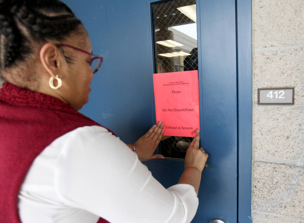 Regina James, a school counselor at Cheyenne High School in North Las Vegas, places a sign outside school's student-run restorative justice tribunal Wednesday, Feb. 21, 2018. K.M. Cannon Las Vegas ...