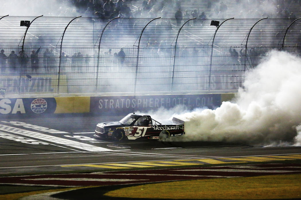 Kyle Busch (51) celebrates after winning his 50th career Camping World Truck Series race at the Las Vegas Motor Speedway in Las Vegas on Friday, March 2, 2018. Andrea Cornejo Las Vegas Review-Jour ...