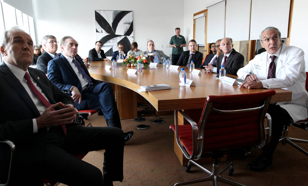 Secretary of Veteran's Affairs David Shulkin, second from left, watches a presentation about the Lou Ruvo Center for Brain Health, Cleveland Clinic with founder Larry Ruvo, left, and Director Dr.  ...