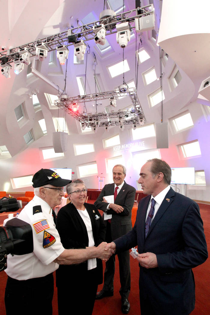 Secretary of Veteran's Affairs David Shulkin, right, meets husband and wife veterans Vincent and Judith Ariola at the Lou Ruvo Center for Brain Health, Cleveland Clinic as founder Larry Ruvo looks ...