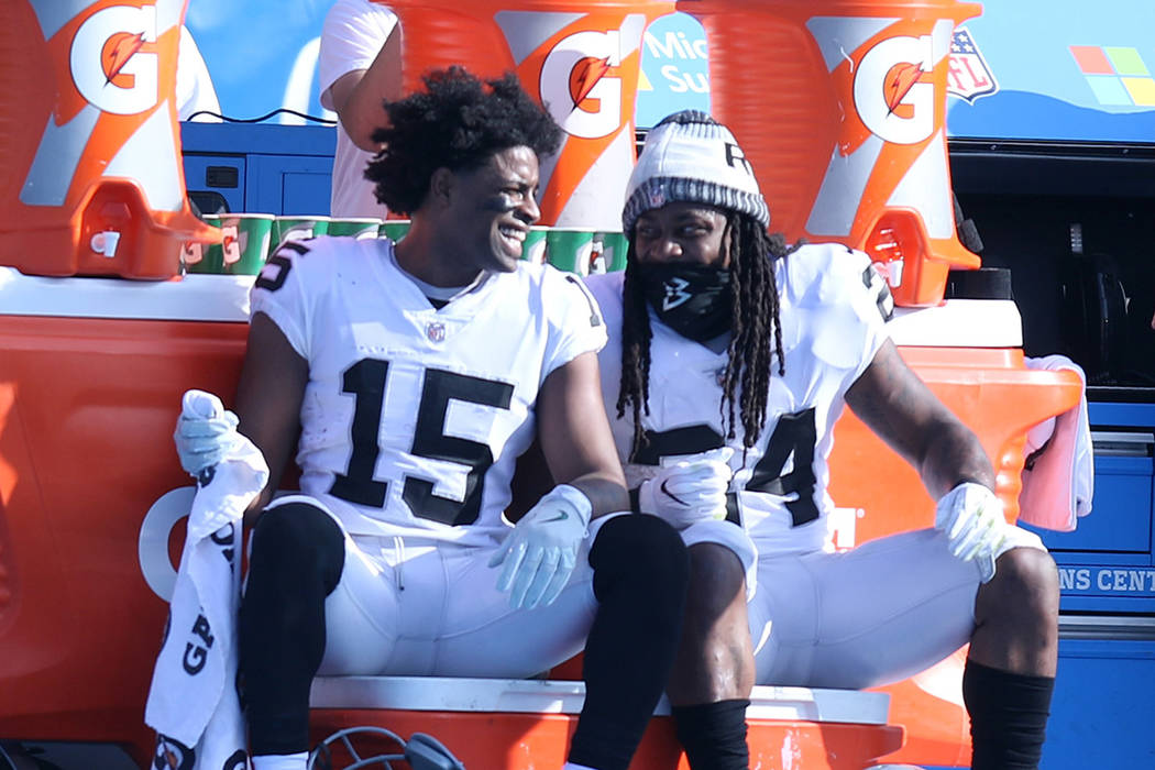 Oakland Raiders wide receiver Michael Crabtree (15) and Oakland Raiders running back Marshawn Lynch (24) share a moment on the sideline during the first half of a NFL game against the Los Angeles  ...
