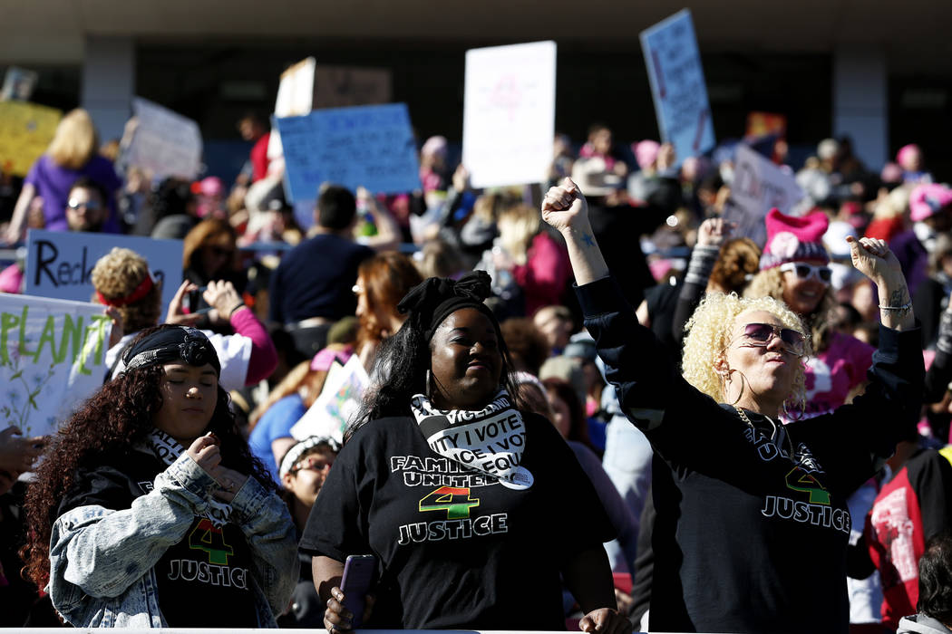 Attendees gather for the Power to the Polls event, hosted by the Women's March, at the Sam Boyd Stadium in Las Vegas, Sunday, Jan. 21, 2018. The event, which served as an advocacy tool to register ...