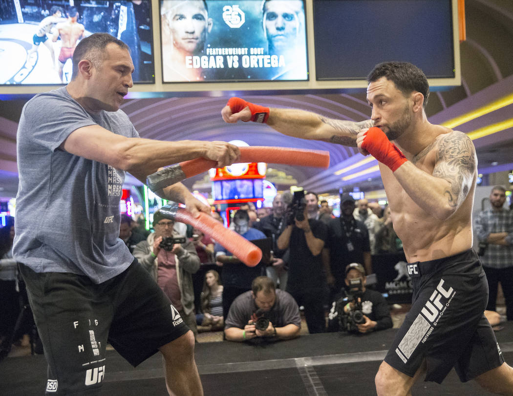 Frankie Edgar, right, the number two UFC featherweight contender, throws a right hook with sparring partner Mark Henry during open workouts leading up to Saturday's UFC 222 on Thursday, March 1, 2 ...