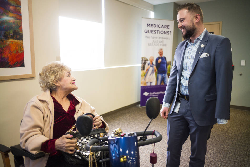 Chris Singer, vice president of Patient Experience at OptumCare, which oversees Southwest Medical, talks with Kathryn Ross, 84, at the Oakey Healthcare Center in Las Vegas on Wednesday, March 7, 2 ...
