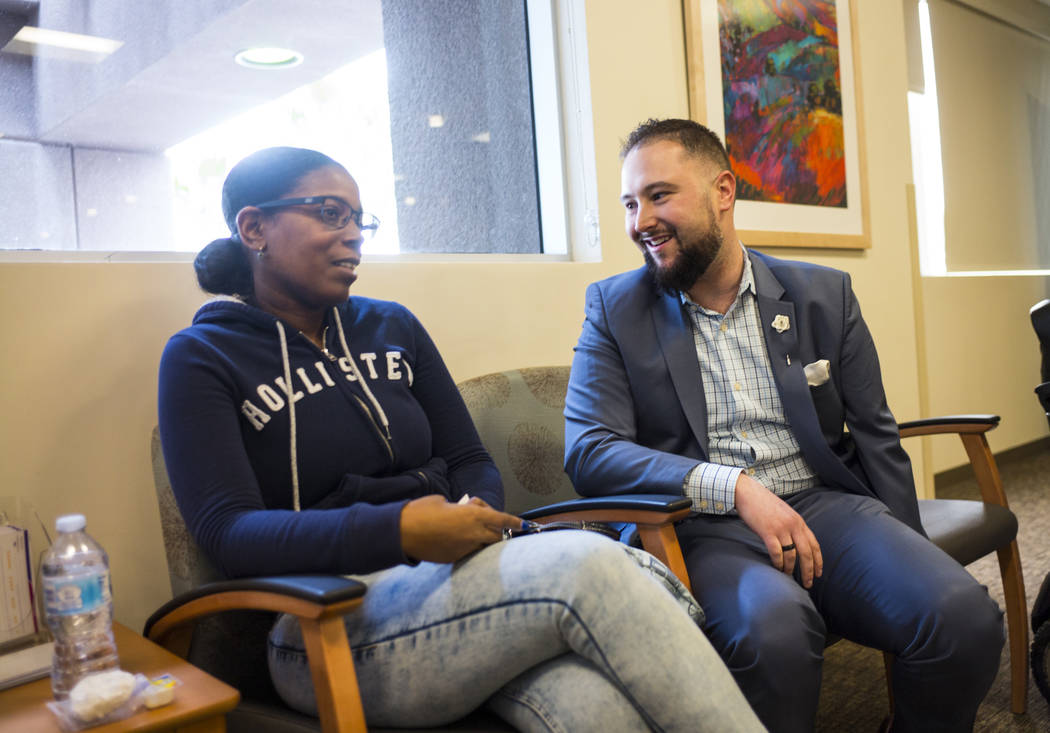 Chris Singer, vice president of Patient Experience at OptumCare, which oversees Southwest Medical, talks to April J., 34, who visited the Oakey Healthcare Center with her mother, in Las Vegas on W ...