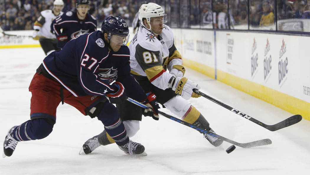 Columbus Blue Jackets' Ryan Murray, left, and Las Vegas Golden Knights' and Jonathan Marchessault chase the puck during the third period of an NHL hockey game Tuesday, March 6, 2018, in Columbus,  ...