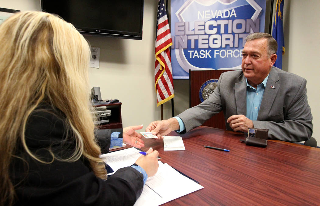 Former Nevada Rep. Cresent Hardy, right, files to run for his old Congressional District 4 seat with Irene Jimenez-Muir at the Secretary of State Las Vegas office Monday, March 5, 2018. Hardy, a R ...