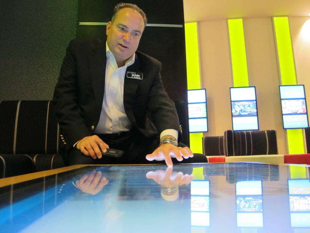 Mark Giannantonio, president of Resorts Casino Hotel in Atlantic City N.J. demonstrates a tabletop internet gambling console at his casino, April 15, 2015. (AP Photo/Wayne Parry, File)