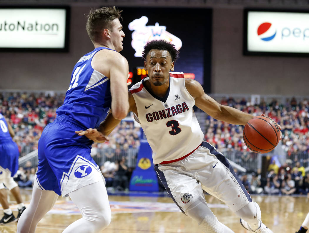 Gonzaga Bulldogs forward Johnathan Williams (3) drive the ball to the hoop as Brigham Young Cougars forward Luke Worthington (41) defends during the West Coast Conference championship game at the  ...
