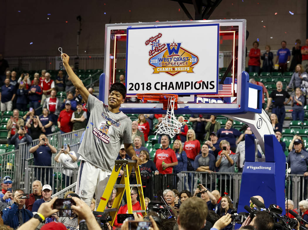 Gonzaga Bulldogs forward Rui Hachimura (21) cuts the net after the Bulldogs defeated the BYU Cougars 74-54 in the West Coast Conference championship game at the Orleans Arena in Las Vegas on Tuesd ...