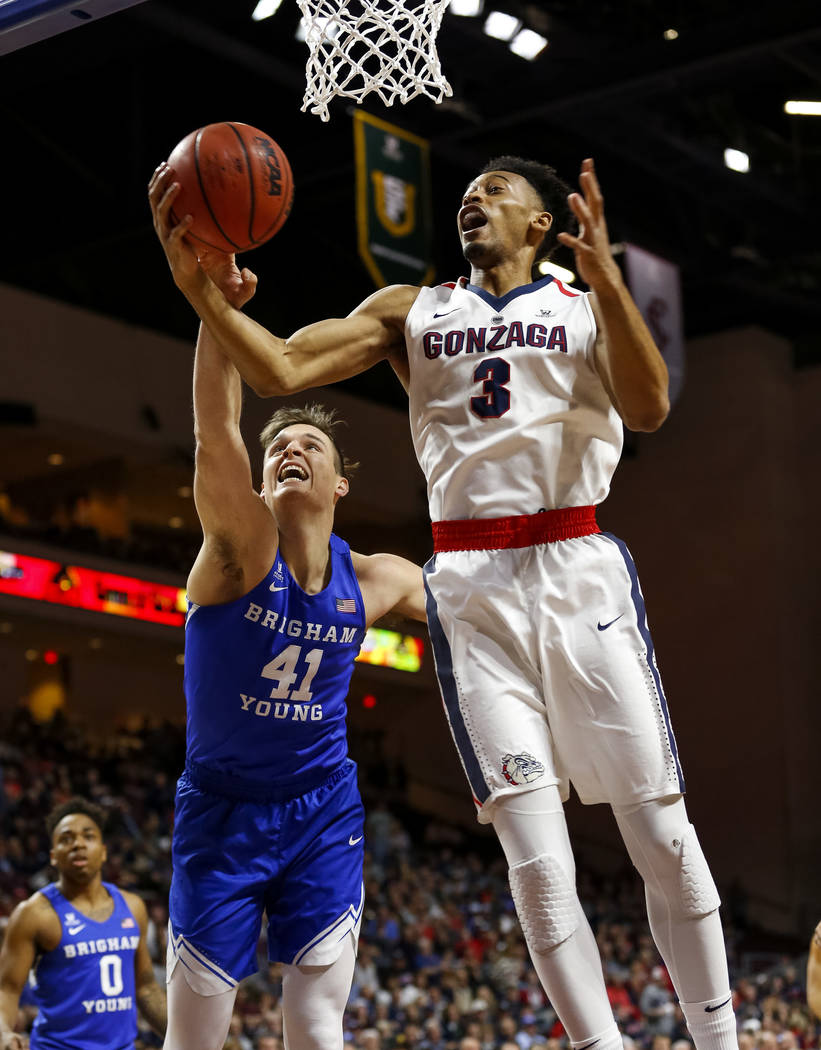 Gonzaga Bulldogs forward Johnathan Williams (3) and Brigham Young Cougars forward Luke Worthington (41) vie for the rebound during the West Coast Conference championship game at the Orleans Arena  ...