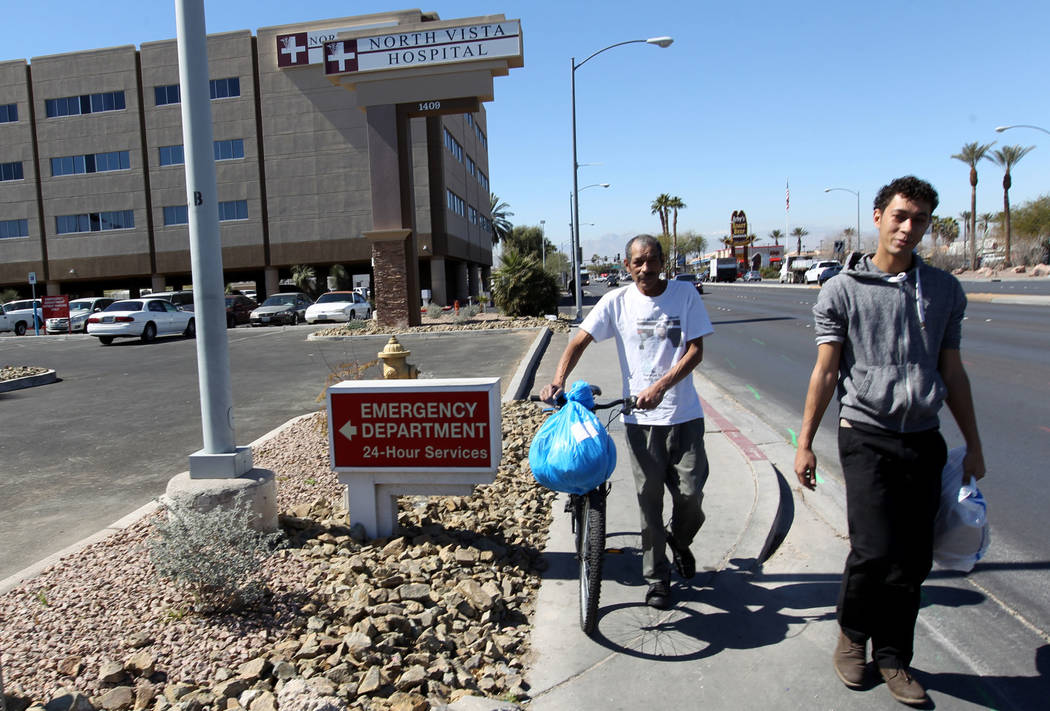 Carlos Sanchez, 61, left, and his son, Jacob Edward Delgado, 23, walk to a bus stop after being released from North Vista Hospital's psychiatric ward Friday, March 9, 2018. K.M. Cannon Las Vegas R ...