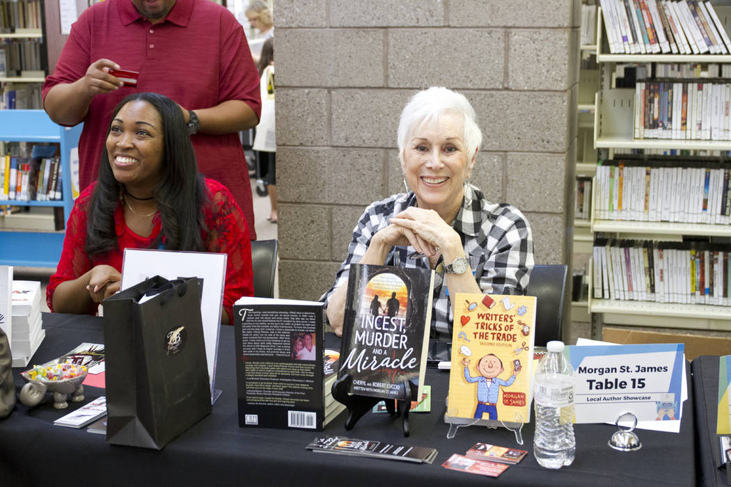 Southern Nevada author Morgan St. James, right,  greets visitors at last year's Local Author's Showcase. (Photo courtesy Henderson Libraries)