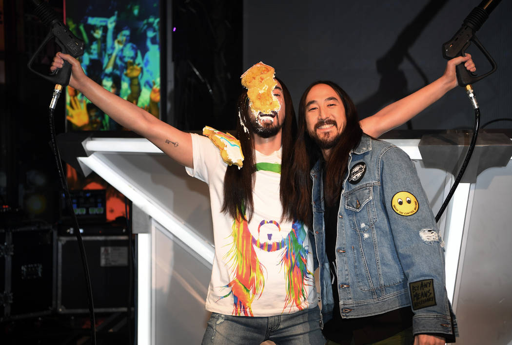 Steve Aoki is shown with his wax figure at Madame Tussauds at The ...