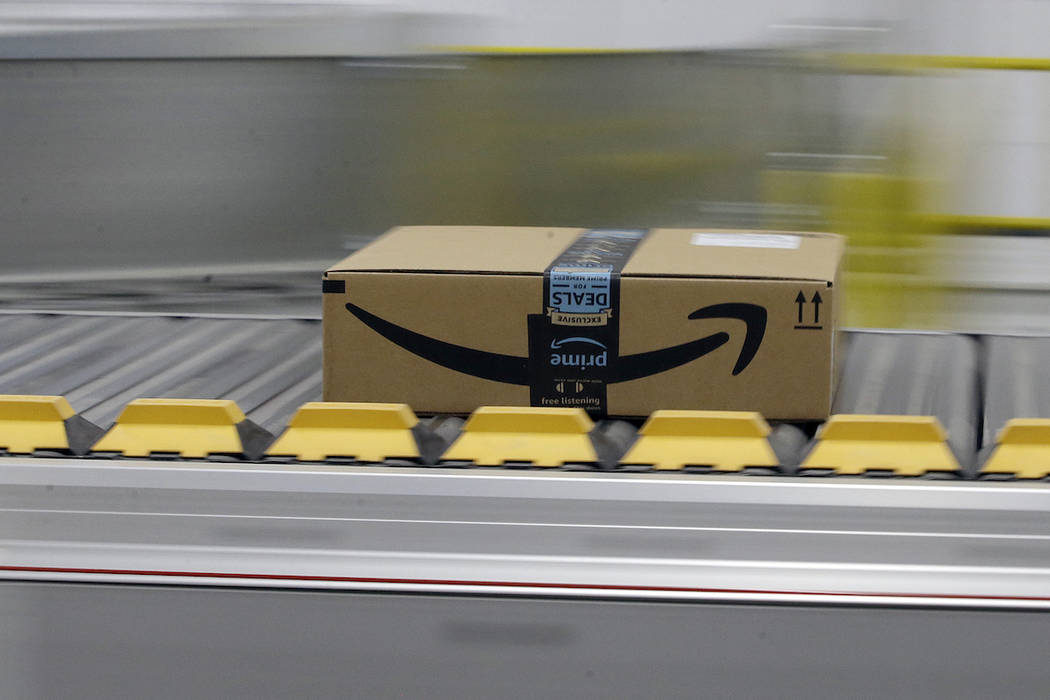 A box for an Amazon prime customer moves through the new Amazon Fulfillment Center in Sacramento, Calif., Feb. 9, 2018.  (AP Photo/Rich Pedroncelli, File)