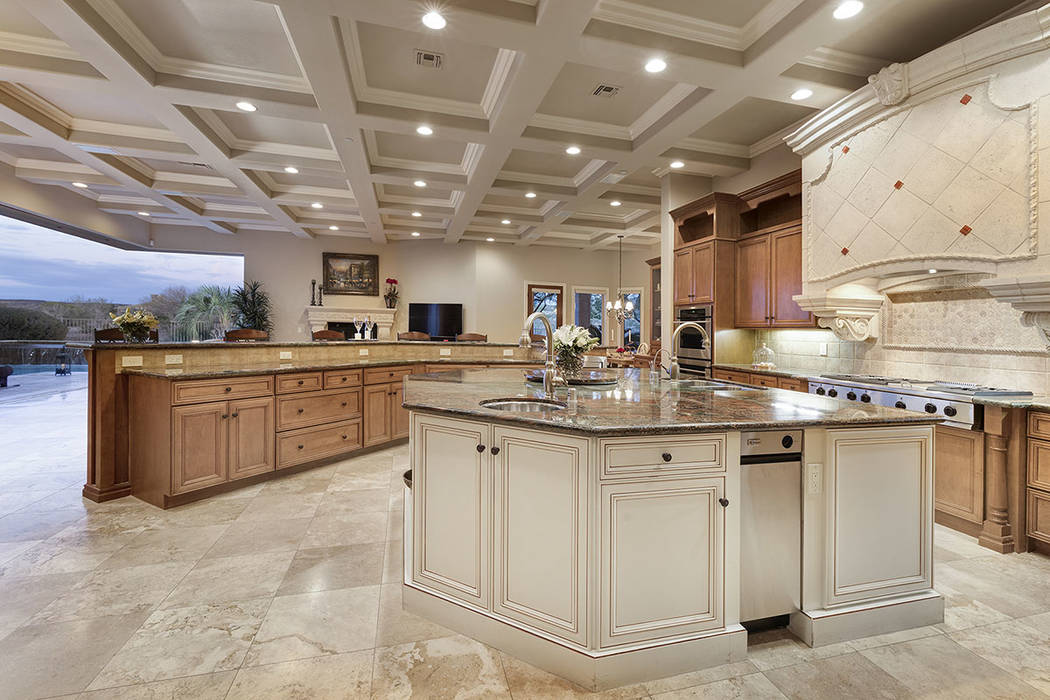 The kitchen opens  to the patio. (Synergy/Sotheby’s International Realty)
