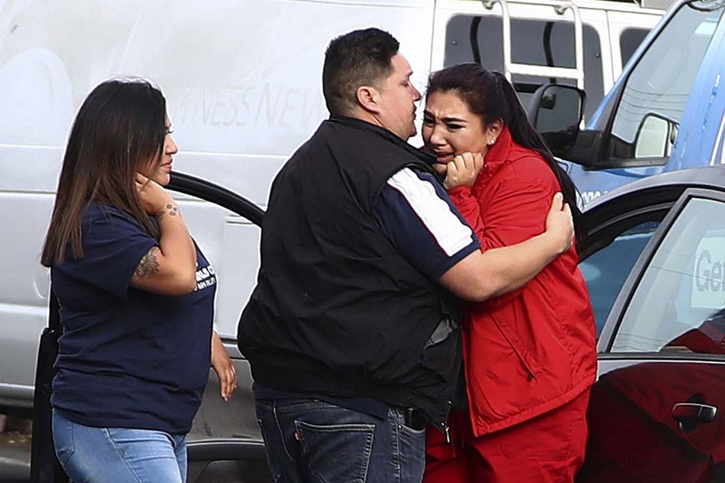 Fernando Juarez, 36, of Napa, center, embraces his 22-year-old sister Vanessa Flores, right, at the Veterans Home of California on Friday March 9, 2018. in Yountville, Calif. Flores, who is a care ...