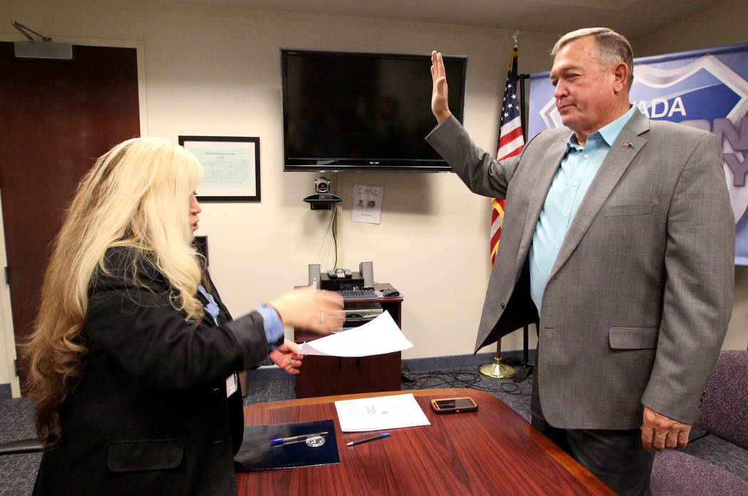Former Nevada Rep. Cresent Hardy, right, takes the oath while filing to run for his old Congressional District 4 seat with Irene Jimenez-Muir at the Secretary of State Las Vegas office Monday, Mar ...