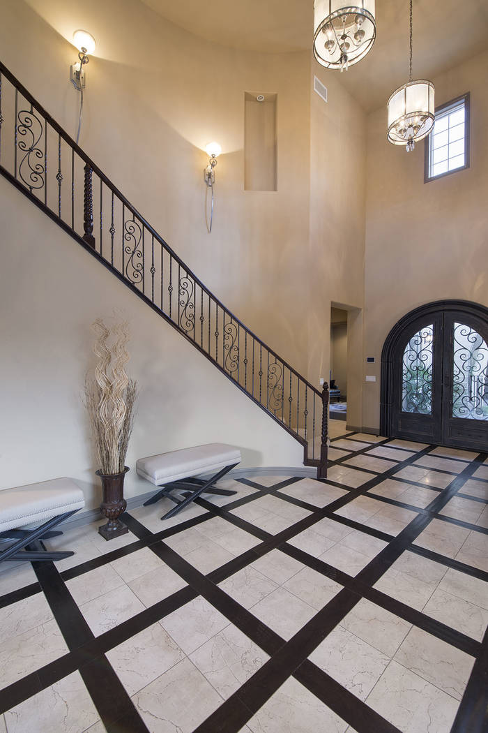 The home has 25-foot ceilings. (Synergy/Sotheby’s International Realty)