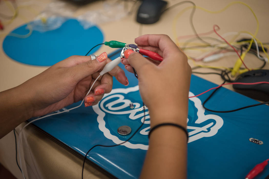 Aysia, 14, working in the "wearable technology" station during Alexa Cafe, an all-girls tech camp, at the Girl Scouts of Southern Nevada on Tuesday, Aug. 8, 2017, in Las Vegas. (Morgan Lieberman/L ...