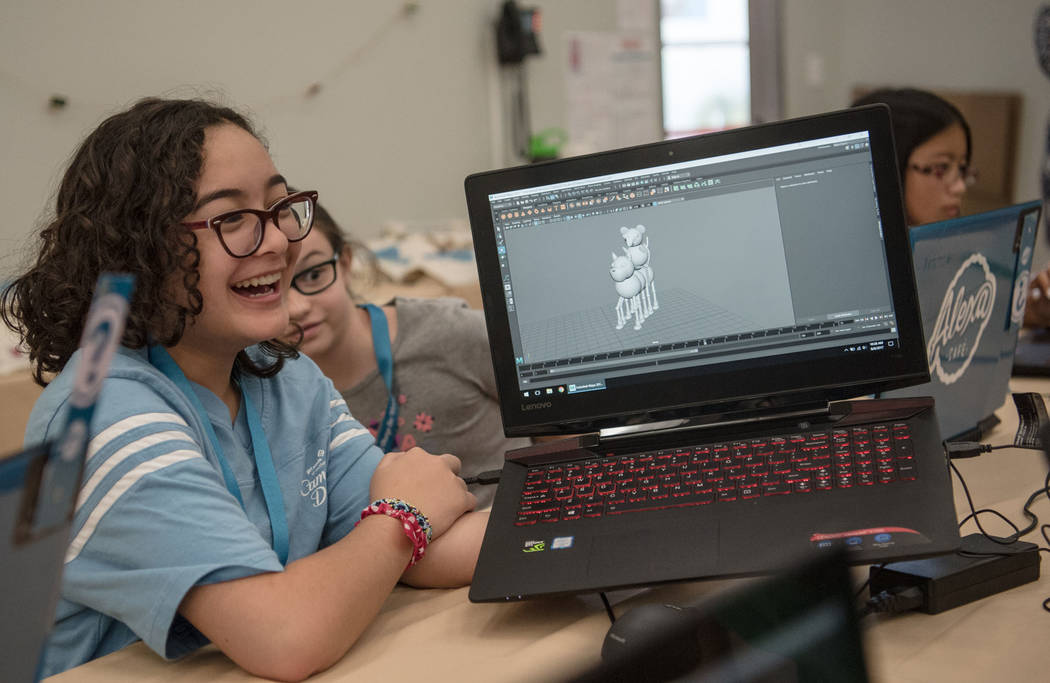 Athena, 13, jokes with other camp members about her 3-D model character during Alexa Cafe, an all-girls tech camp, at the Girl Scouts of Southern Nevada on Tuesday, Aug. 8, 2017, in Las Vegas. (Mo ...