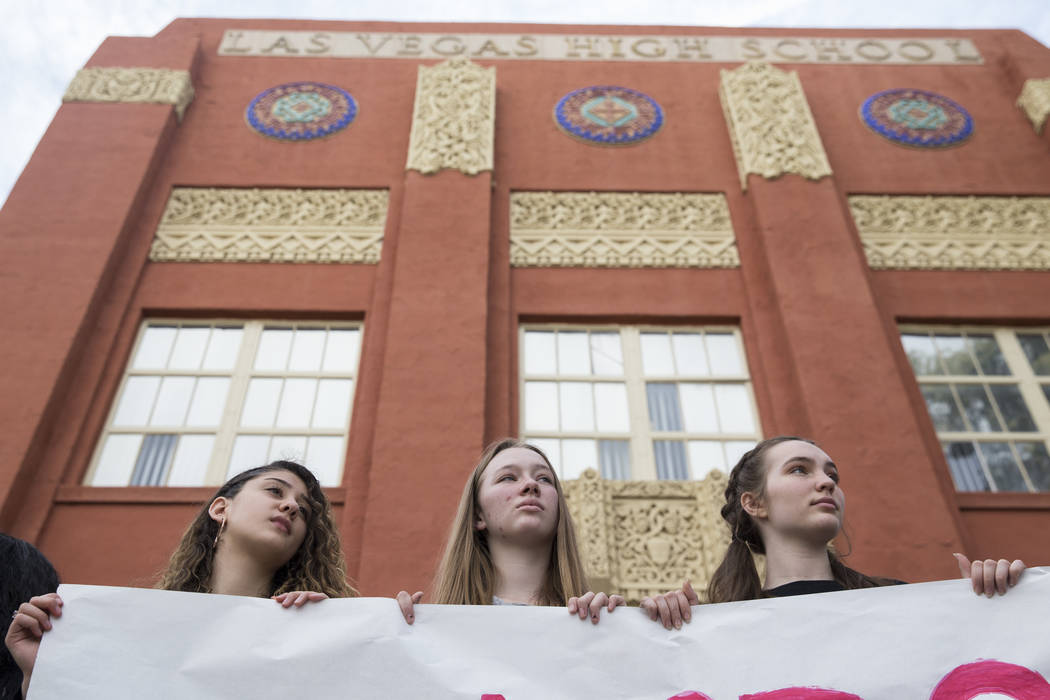 Students from left, Yasmine Abdelshahid, 15, Katelyn Murphy, 15, and Audrey Freund, 15, participate in the national walkout to protest gun violence, at Las Vegas Academy in Las Vegas, Wednesday, M ...