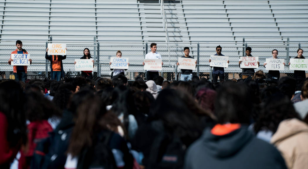 Students at Clark High School in Las Vegas hold up names of each of the 17 victims in the Parkland shooting during the national student walkout, March 14, 2018. (Marcus Villagran)