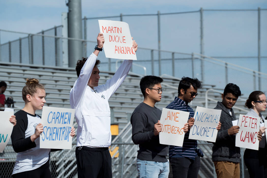 Students at Clark High School in Las Vegas hold up names of each of the 17 victims in the Parkland shooting during the national student walkout, March 14, 2018. (Marcus Villagran)