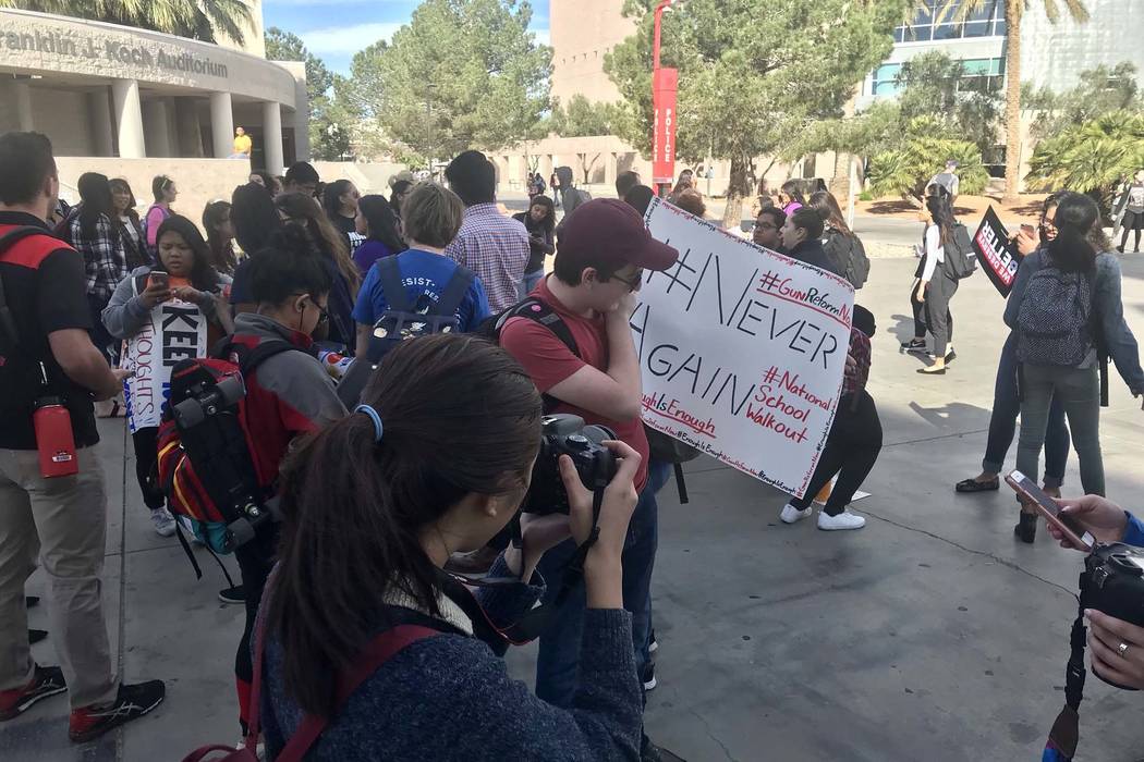 UNLV students gather in a free speech zone on campus to march to protest gun violence, Wednesday, March 14, 2018. (Natalie Bruzda/Las Vegas Review-Journal)
