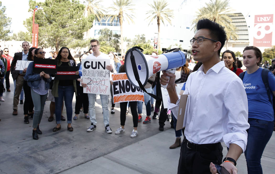 Karl Catarata, right, shouts slogans as UNLV students prepare to march at their campus in Las Vegas on Wednesday, March 14, 2018 as part of a nationwide protest against gun violence. Bizuayehu Tes ...