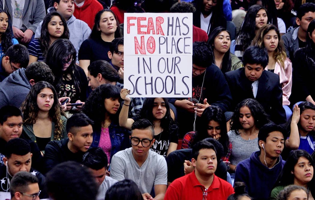 Students listen during an assembly at Valley High School in Las Vegas, Wednesday, March 14, 2018. Students organized an assembly to talk about gun control in response to the Parkland shooting. Rac ...