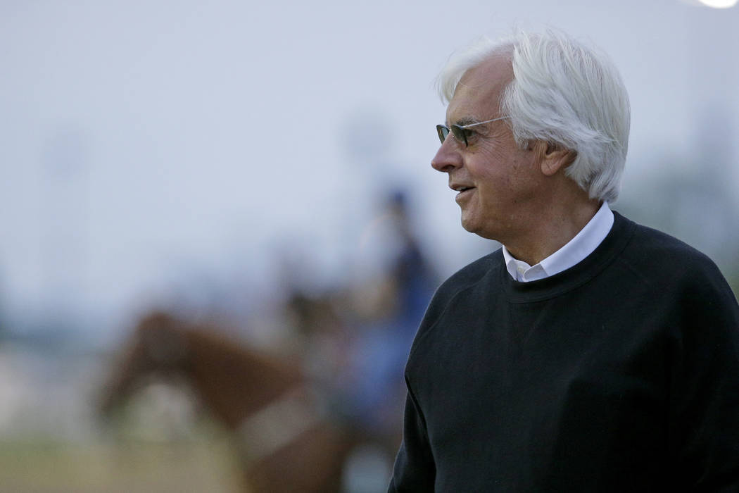 Trainer Bob Baffert watches a workout at Churchill Downs Tuesday, May 3, 2016, in Louisville, Ky. The 142nd running of the Kentucky Derby is scheduled for Saturday, May 7. (AP Photo/Charlie Riedel)