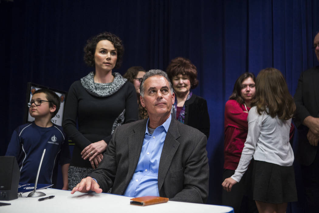 Danny Tarkanian files for his candidacy for the 3rd Congressional District of Nevada with his wife Amy, their four children and Las Vegas City Councilwoman Lois Tarkanian behind him at the Clark C ...