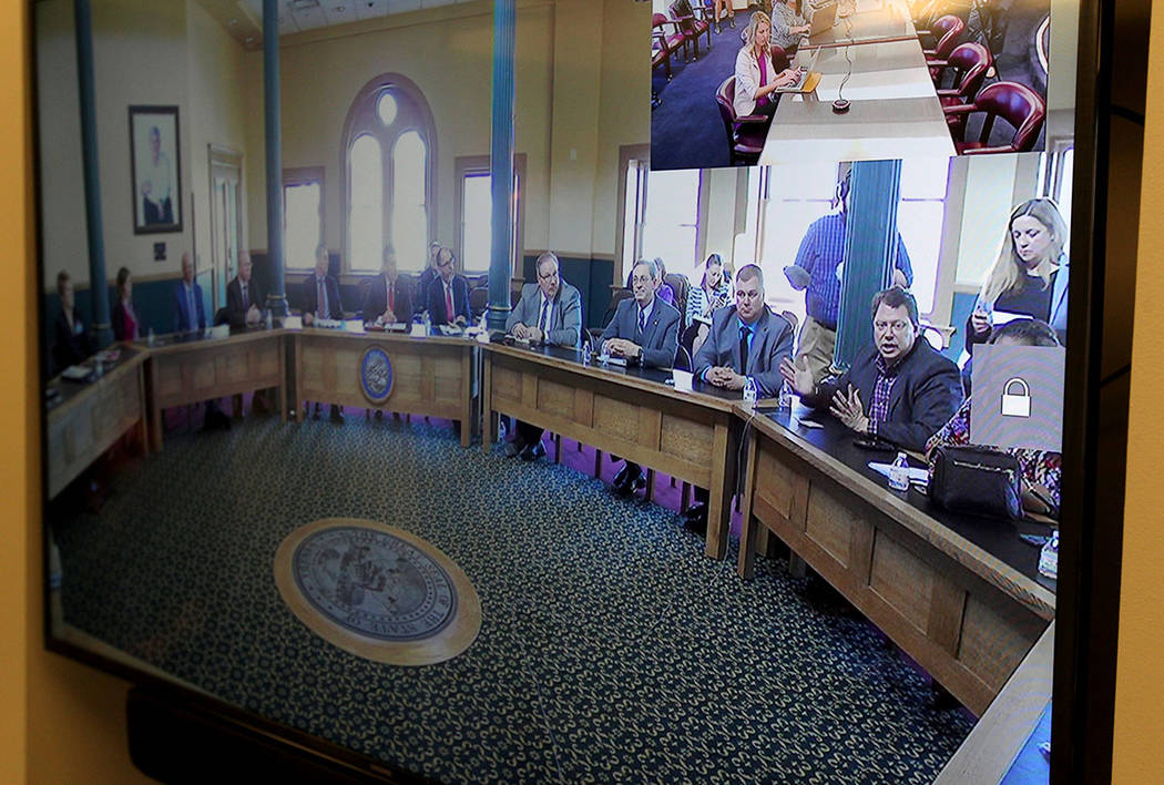 Clark County schools Superintendent Pat Skorkowsky, seated right, answers a reporter's question during a roundtable discussion on school safety with Nevada school superintendents hosted by Gov. Br ...
