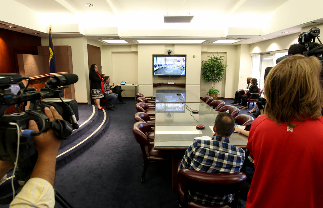Gov. Brian Sandoval hosts a roundtable with Nevada school superintendents in Carson City and teleconferenced at the Sawyer Building in Las Vegas Monday, March 12, 2018, to discuss school safety. ( ...