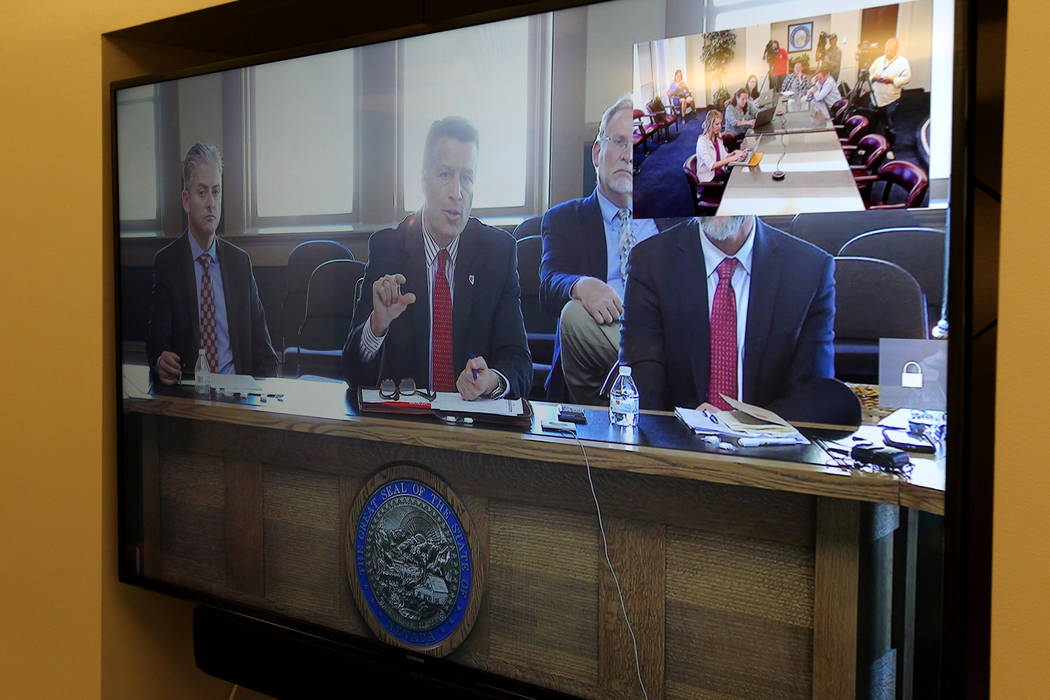Gov. Brian Sandoval hosts a roundtable with Nevada school superintendents in Carson City and teleconferenced at the Sawyer Building in Las Vegas Monday, March 12, 2018, to discuss school safety. ( ...