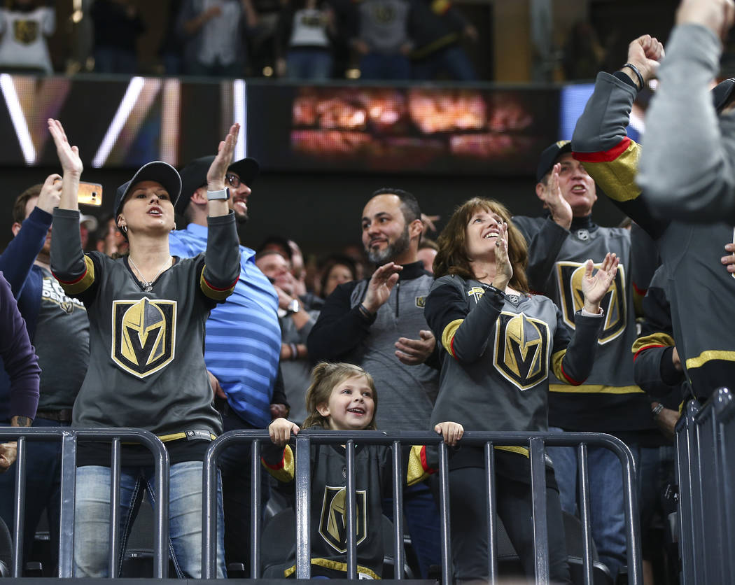 Golden Knights fans celebrate a goal by center Cody Eakin (21) against the Vancouver Canucks during the first period of an NHL hockey game at T-Mobile Arena in Las Vegas on Tuesday, March 20, 2018 ...