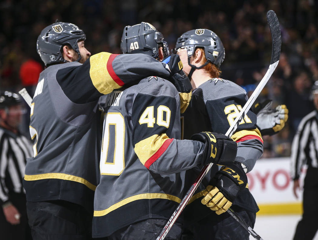 Golden Knights players celebrate a goal by center Cody Eakin (21) against the Vancouver Canucks during the first period of an NHL hockey game at T-Mobile Arena in Las Vegas on Tuesday, March 20, 2 ...