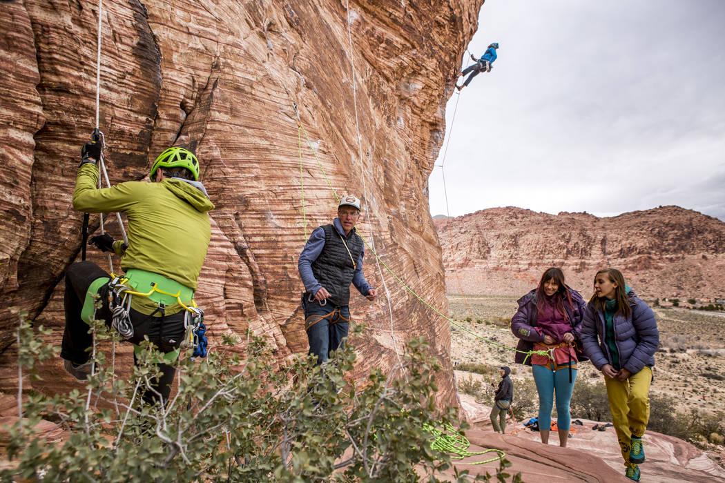 Professional photographer John Evans, second from left, teaches a climbing photography clinic as climbers Gorge Bieker of Arkansas, left, and Greg Tambornino of Minneapolis, third from left, climb ...