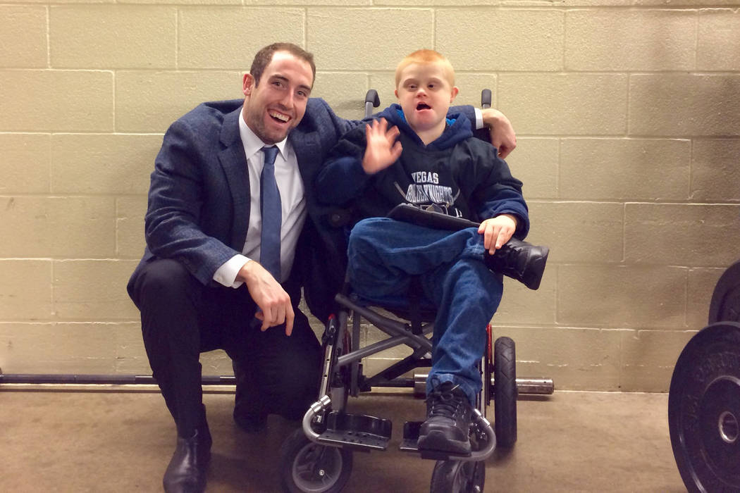 Brad Hunt poses for a photo with a fan, Chase Buell, on December 9, 2017. (@3cmb21/Twitter)