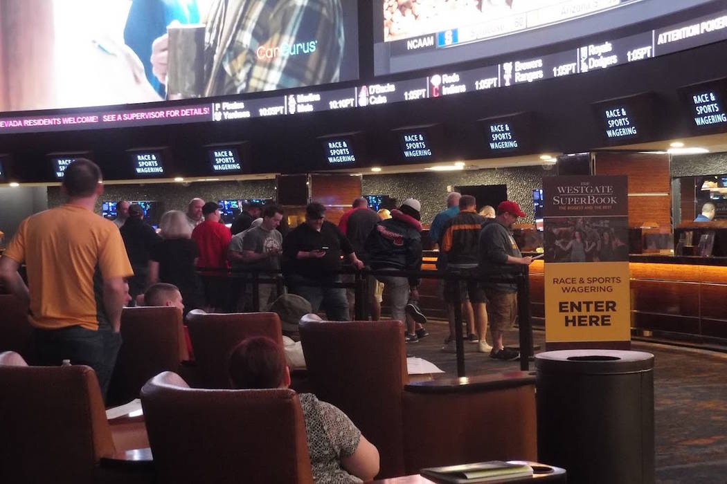 Fans line up to bet on the NCAA Tournament for men's basketball at the Westgate Las Vegas sports book on Thursday, March 15, 2018. (Max Michor/Las Vegas Review-Journal)