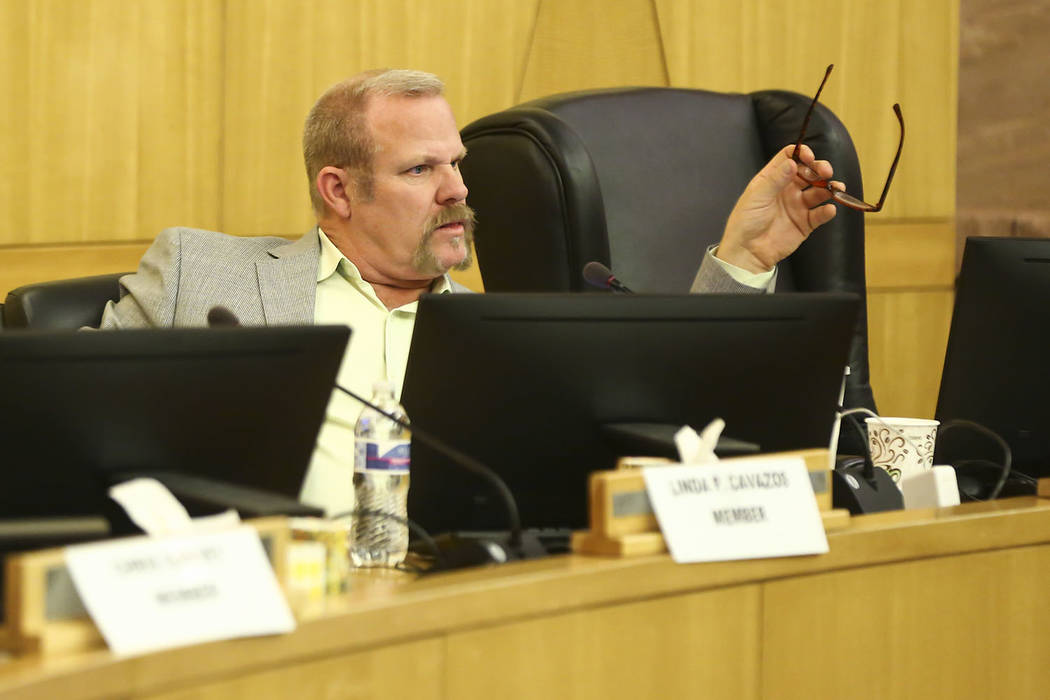 Clark County School District trustee Kevin Child reacts during a settlement case involving Child and Deputy Superintendent Kim Wooden during a CCSD Board of Trustees meeting at the County Governme ...