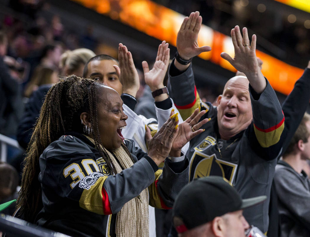 Fans celebrate after the Golden Knights' third goal of the game during the second period of an NHL hockey game at T-Mobile Arena in Las Vegas on Friday, Feb. 23, 2018.  Patrick Connolly Las Vegas  ...