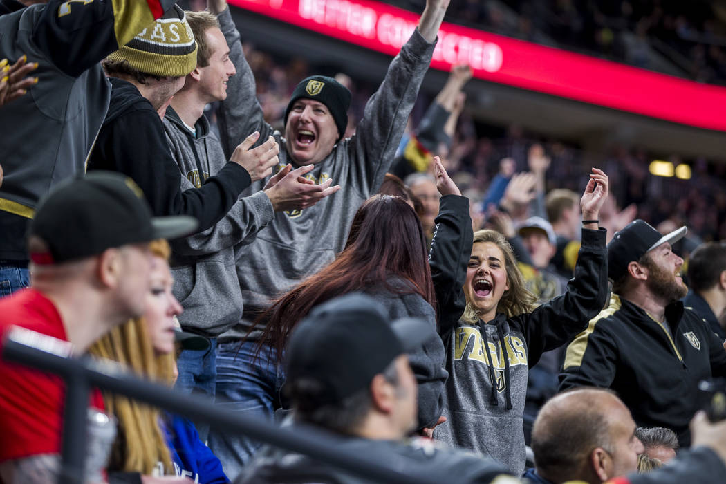 Fans celebrate after the Golden Knights' third goal of the game during the second period of an NHL hockey game at T-Mobile Arena in Las Vegas on Friday, Feb. 23, 2018.  Patrick Connolly Las Vegas  ...