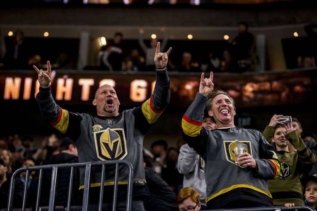 Knights fans celebrate after the sixth Knights goal of the game during the third period of an NHL hockey game at T-Mobile Arena in Las Vegas on Friday, Feb. 23, 2018. The Knights won 6-3.  Patrick ...