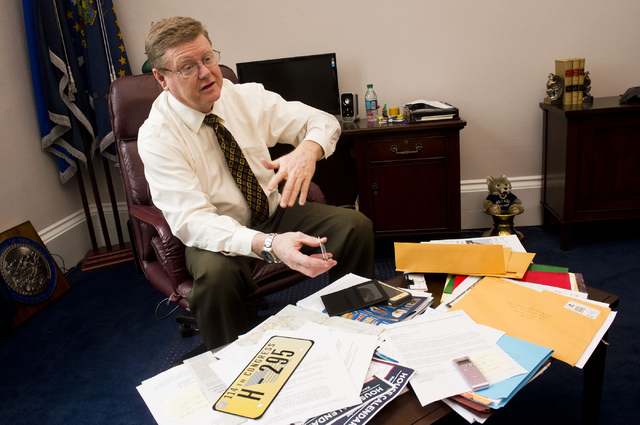 In his Capitol Hill office on Tuesday, Rep. Mark Amodei, R-Nev., displays the lapel pin, license plate and other items given to members of Congress before a new session. (Lisa Helfert/ Stephens Media)