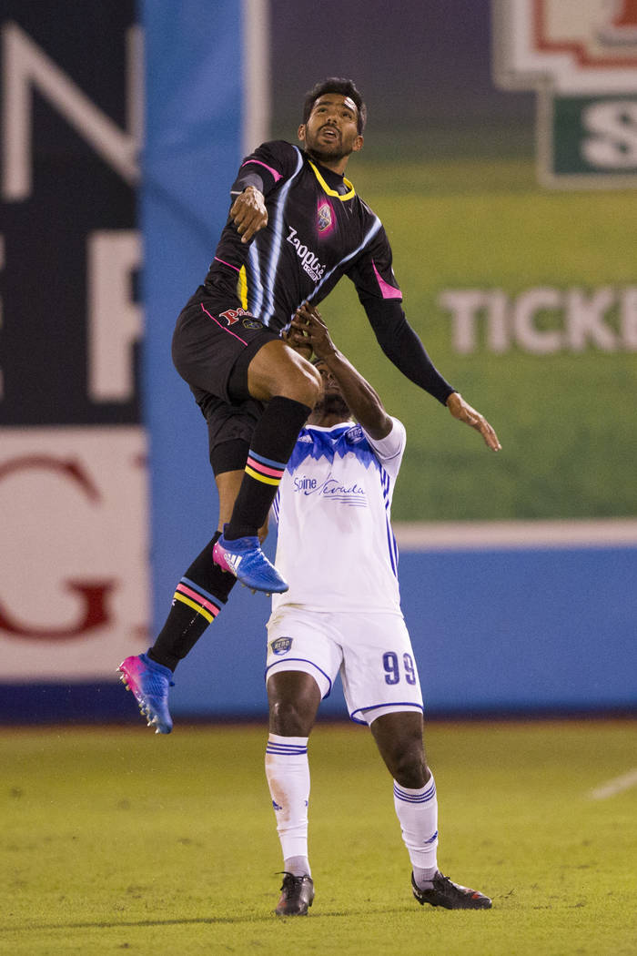 Las Vegas Lights FC’s  Miguel Angel Gardun~o (33) goes up for the ball against Reno 1868 FC’s Brian Brown (99) during the first half of the United Soccer League game at Cashman Field ...