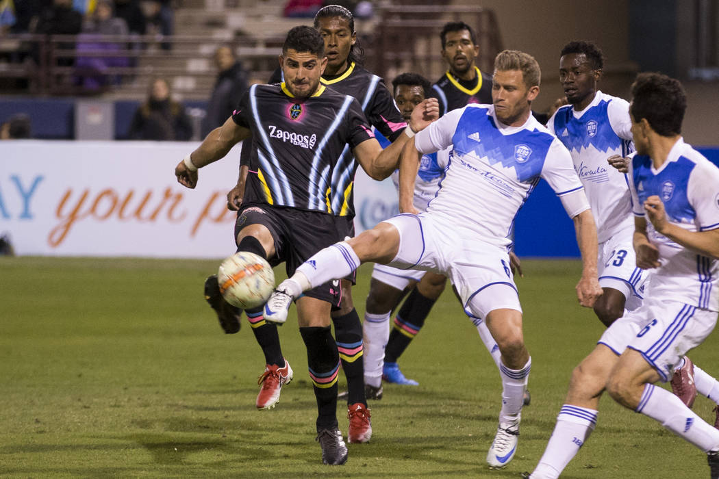 Las Vegas Lights FC’s Marco Cesar Jaime Jr. (6), left, and Reno 1868 FC’s Guy Abend (8) go for the ball during the second half of the United Soccer League game at Cashman Field in La ...