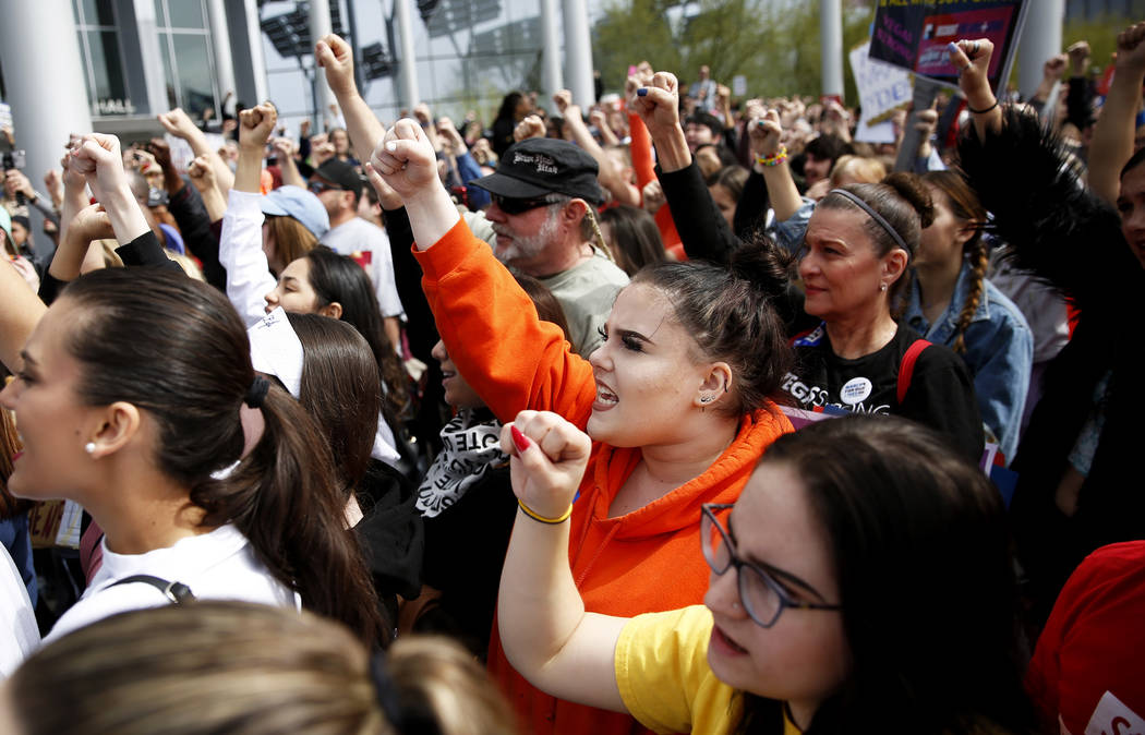 Paige Rawlinson, a 17-year-old student from Arbor View High School, center, participates in the Las Vegas March for Our Lives event, which started at Symphony Park and ended in Las Vegas City Hall ...