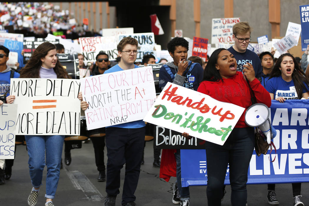 Attendees participate in the Las Vegas March for Our Lives event, which started at Symphony Park and ended in Las Vegas City Hall, on Saturday, March 24, 2018. Andrea Cornejo Las Vegas Review-Jour ...
